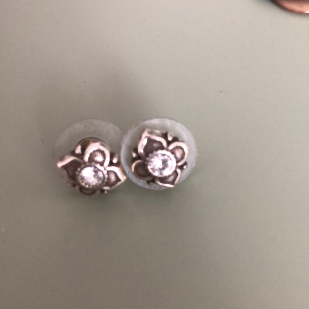 Silver earrings with clear stud.